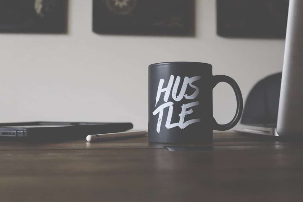 A mug with the word HUSTLE. You just have to keep hustling if you want to see results!