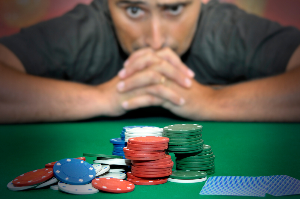 A man is gambling with a pile of poker chips. Is matched betting gambling? No, not like traditional gambling!