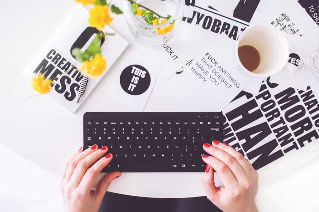 Woman with keyboard and coffee. Get creative and make your own designs which can be applied to various products to sell!