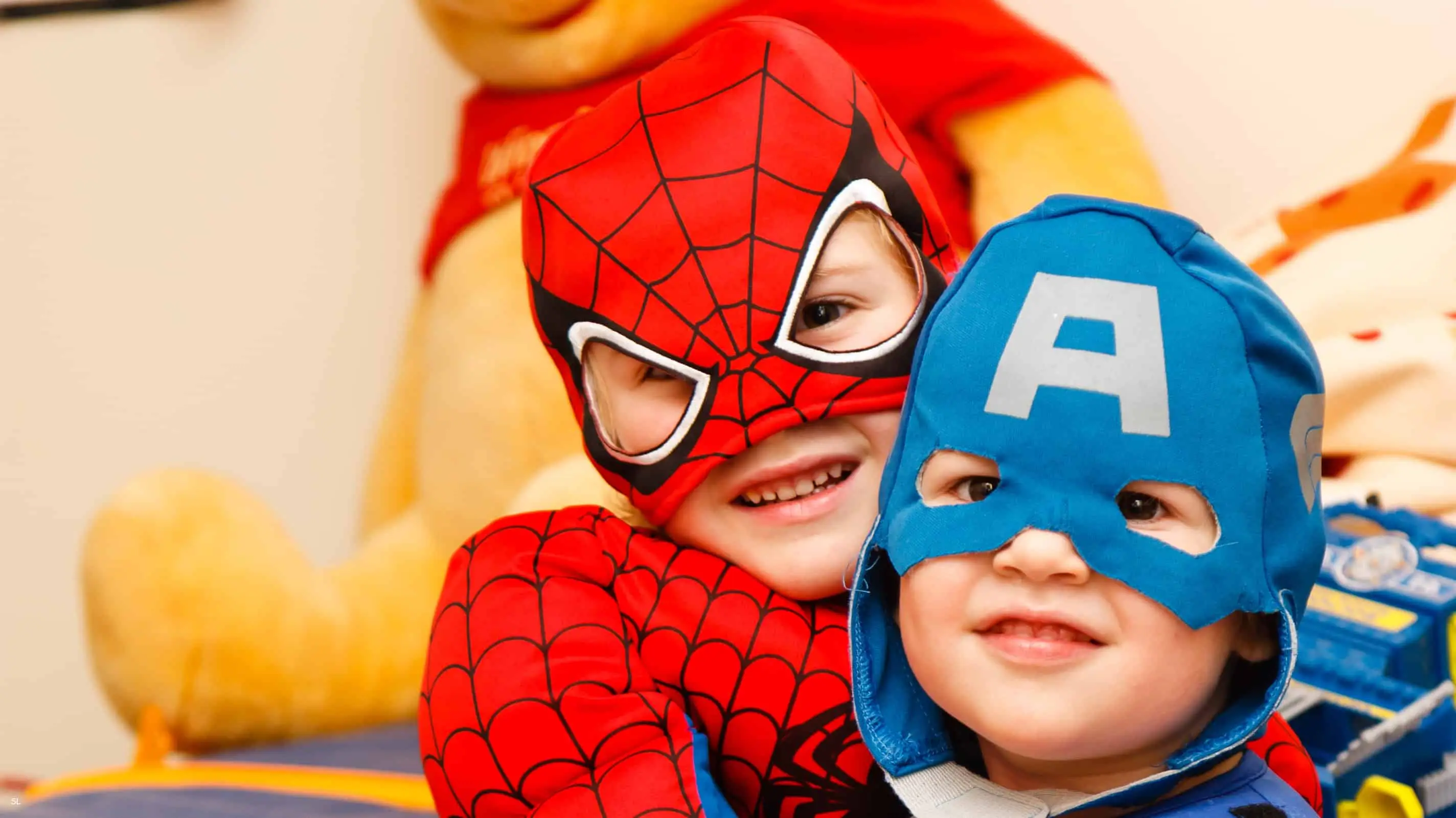 Two little boys in superhero costumes. Could you sew costumes like this as a side hustle?