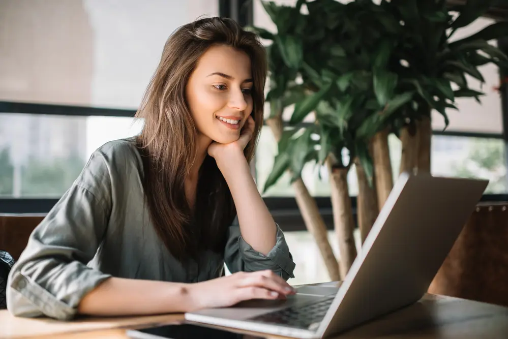 a freelance writer working on her laptop