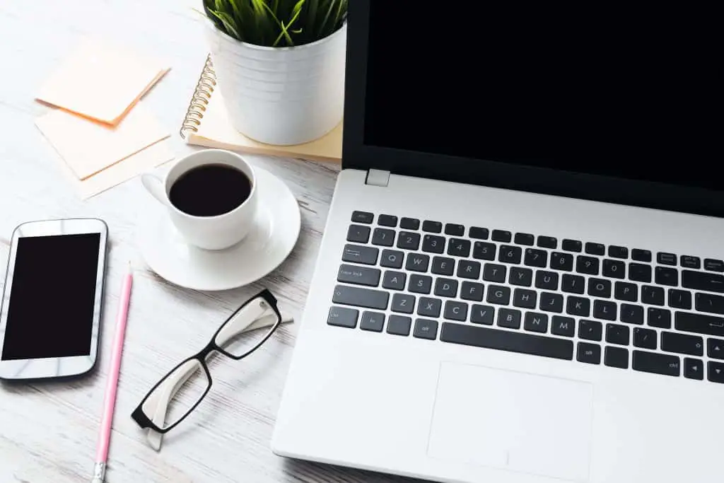 blogger desktop shot with laptop and coffee. Coffee definitely helps me write faster!