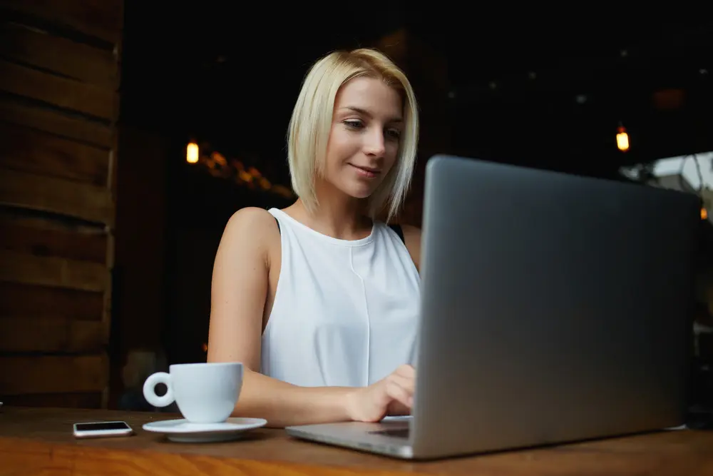 female consultant typing on her laptop