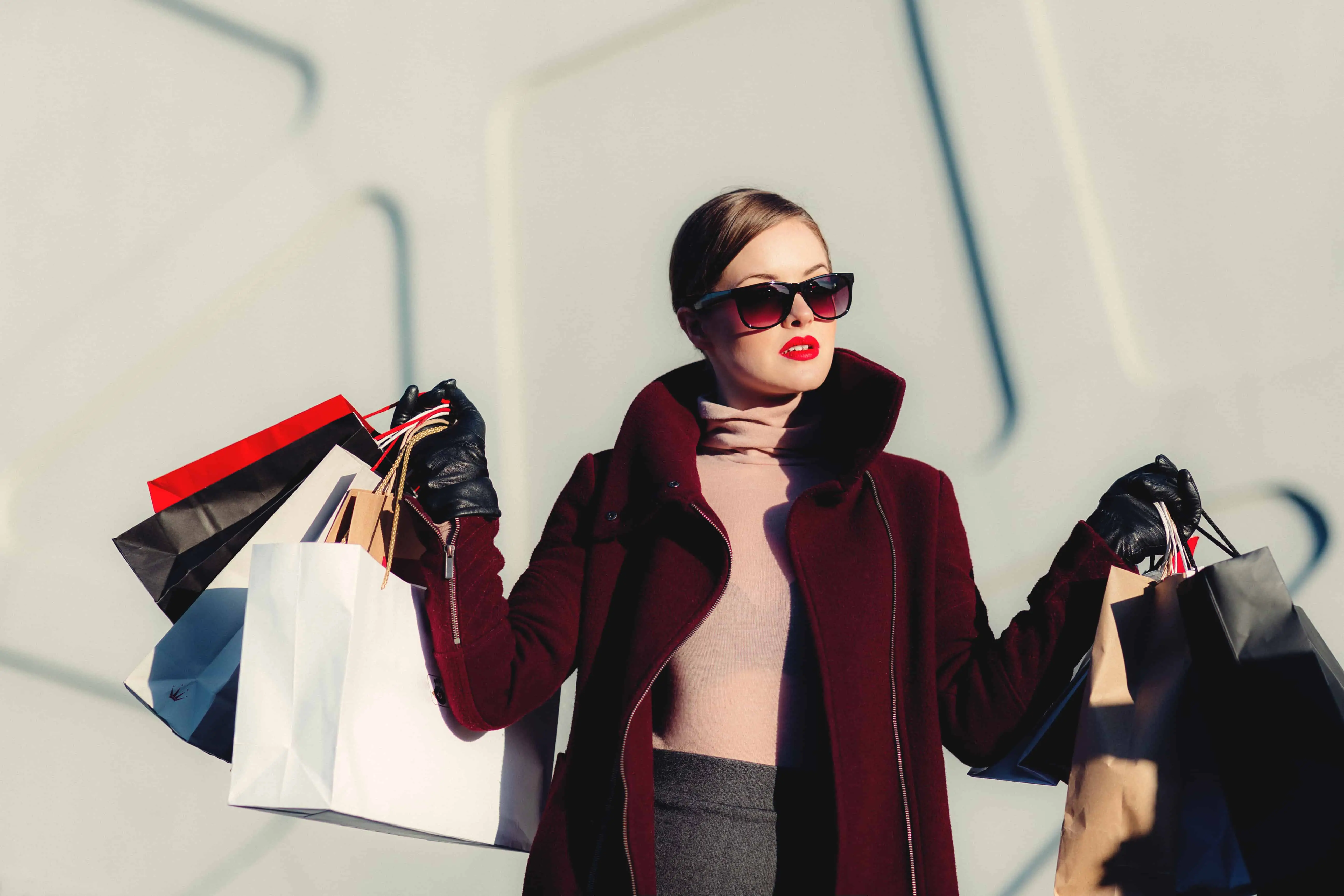 A woman with lots of shopping bags. Could you make money as a personal shopper?